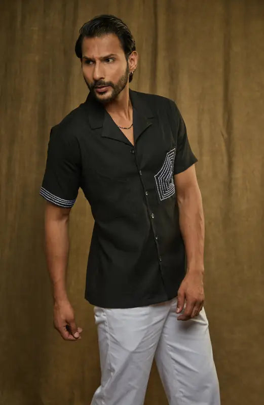 Black Milo Work Shirt with Relaxed Cuban Collar and Minimalistic Pocket paired with white pants